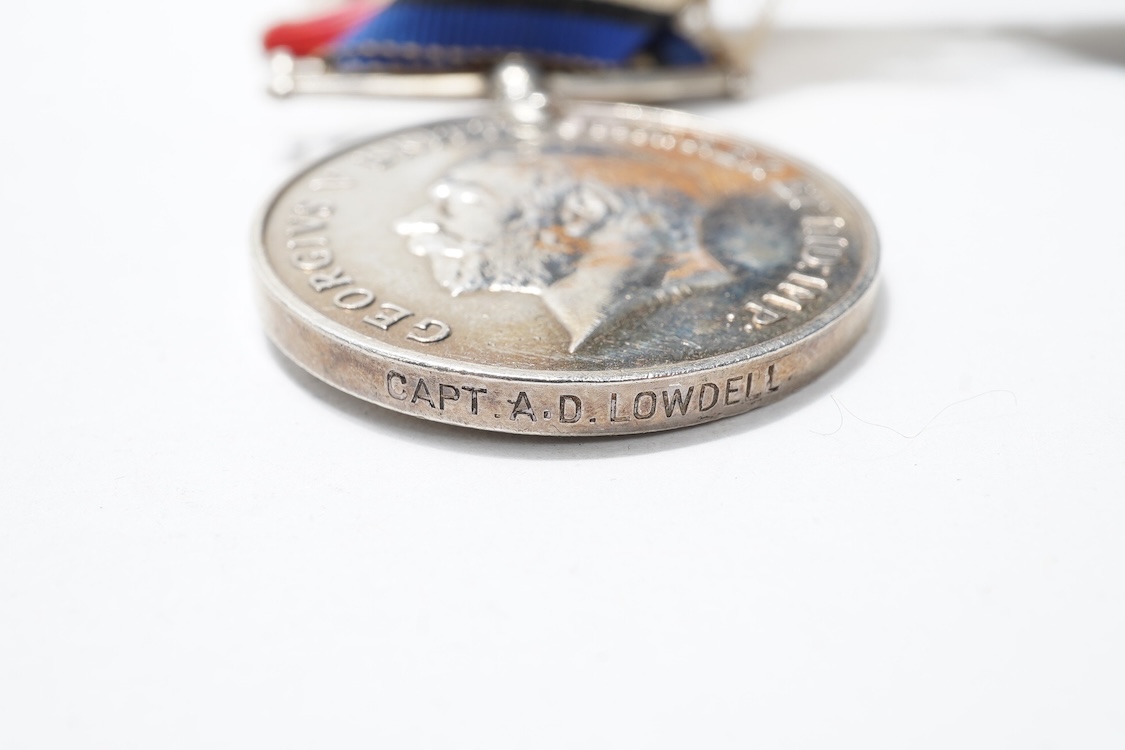 A First World War Mons Star trio awarded to Capt. A.D. Lowdell, with a clasp for 5th Aug-22nd Nov 1914, and oakleaf - mention in dispatches, together with the miniature set, plus a WWII Defence medal in its original card